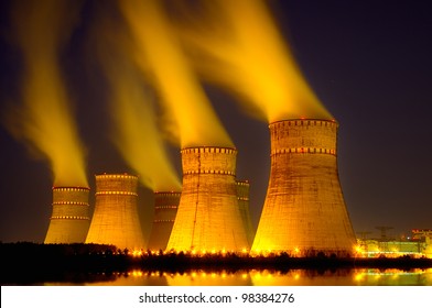 The cooling towers at night of the nuclear power generation plant