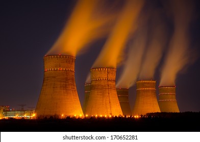 The Cooling Towers Of The Nuclear Power Plant At Night