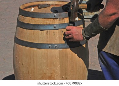 Cooper Hands Fixing Wine Wood With Chisel And Hammer. Making A Wooden Barrel. Cooperage