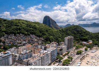 Copacabana Beach and buildings by the coastline with Sugarloaf Mountain in the background, Rio de Janeiro