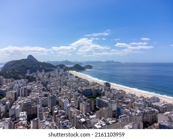 Copacabana Beach In Rio De Janeiro With Aerial Views Of Drone, Buildings And Beach.