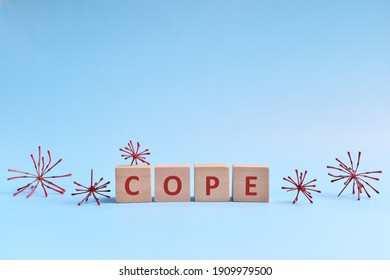 Cope Word In Wooden Blocks On Blue Background. Coping With Anxiety, Stress, Ptsd And Depression During Covid-19 Pandemic Concept.