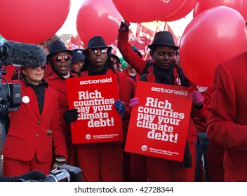 COPENHAGEN - DEC 12:Members Of Action Aid Protest At The Parliament Buildings During The UN Conference On Climate Change On December 12, 2009 In Copenhagen.