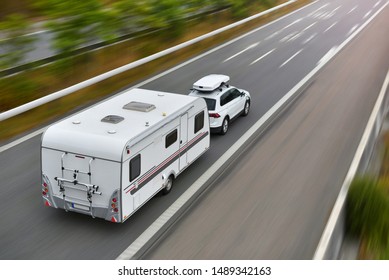 Copenhagen / Denmark - 07.22.19: Travel On Car With Caravan Trailer By Highway	