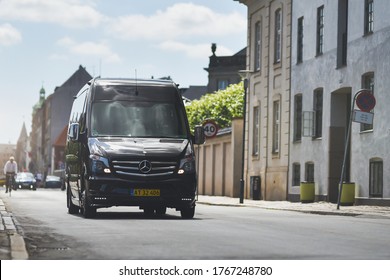 Copenhagen / Denmark - 07.23.19: Black Business Minibus Drive By Downtown
