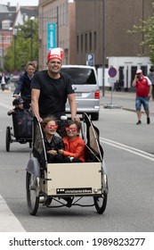 Copenhagen, Denmark - 12-06-2021: Danish Soccer Fan On Cargobike With Kids, Outside National Stadium Before The Denmark - Finland Match