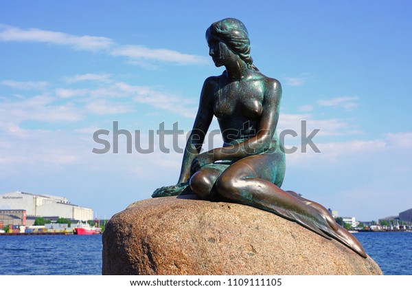 COPENHAGEN, DENMARK -15\
MAY 2018- View of the Little Mermaid, a bronze statue by Edvard\
Eriksen, on a rock by the waterside at the Langelinie promenade in\
Copenhagen,\
Denmark.