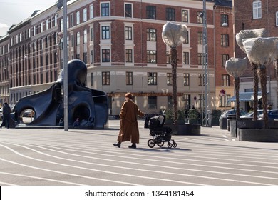 Copenhagen/ Denmark - 19. March 2019: Mother Talking A Walk In Superkilen Park In Nørrebro District.