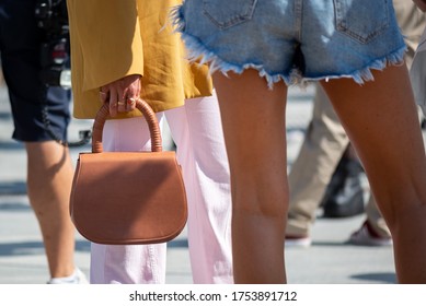 COPENHAGEN, DENMARK - AUGUST 11 2018: Street Style During Copenhagen Fashion Week Spring Summer 2019. Outfit: Details, Denim Shorts And Brown Bag.