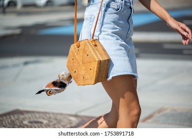 COPENHAGEN, DENMARK - AUGUST 11 2018: Street Style During Copenhagen Fashion Week Spring Summer 2019. Outfit: Denim Skirt And Brown Bag With Feather.