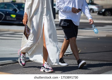 COPENHAGEN, DENMARK - AUGUST 11 2018: Street Style During Copenhagen Fashion Week Spring Summer 2019. Outfit: White Dress, Shorts, Sneakers, Couple.