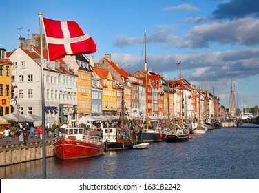 COPENHAGEN, DENMARK - AUGUST 25: Unidentified People In Open Cafes Of The Famous Nyhavn Promenade On August 25, 2010 In Copenhagen, Denmark. Nyhavn Is One Of The Most Famous Landmark Of Copenhagen.