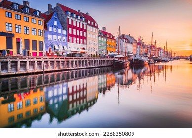 Copenhagen, Denmark. Charm of Nyhavn Canal, iconic place, colorful sunrise, and breathtaking water reflections. - Powered by Shutterstock