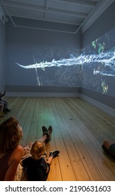 Copenhagen, Denmark. Circa July 2022. Interior Of Science Museum. Family And Kids Enjoying An Audiovisual Immersive Experience