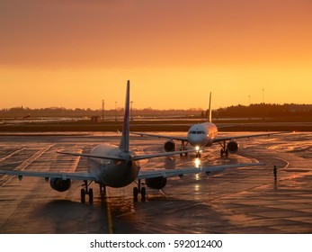 Copenhagen, Denmark – Dec 16 2005: An Arriving Airbus And A Departing Boeing Airplane In A Position Of Crossing Each Other's Course Representing Confrontations Of The Two Aircraft Manufacturers.