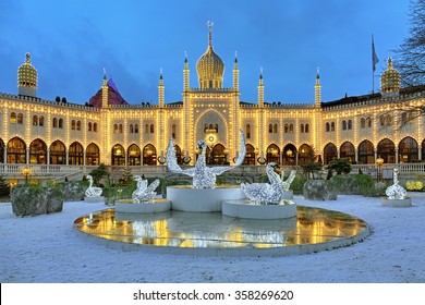 COPENHAGEN, DENMARK - DECEMBER 14, 2015: The Christmas Installation With Swans In Front Of The Moorish Palace In Tivoli Gardens. Since 2008 In The Palace Located The Five-star Boutique Hotel Nimb.