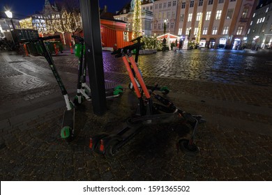 Copenhagen / Denmark - December 17 2019: Parked Electric Scooters Block The Sidewalk Next To Christmas Market At Højbro Plads, Copenhagen.