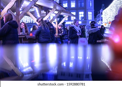 Copenhagen / Denmark - December 17 2019: People Enjoying Their Time In The Evening At The Højbro Plads Christmas Market In Copenhagen.