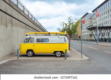 Copenhagen. Denmark. July 22nd. 2019. Beautiful yellow minibus with surfing on the trunk. Transport. Travels Hobby Recreation
