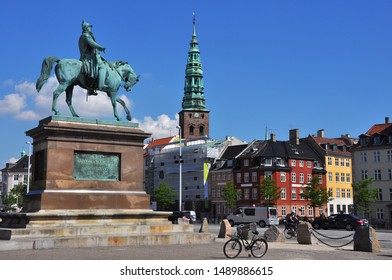 Copenhagen, Denmark - June 7 2013: Equestrian Statue Of Absalon On Højbro Plads In Copenhagen, Denmark With People Crossing The Square