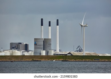 COPENHAGEN, DENMARK - MAY 13, 2019: Hofor City Utility Plant In Copenhagen, District Heating, Wastewater Management And Other Utility Services. Oil Silos Of The Industrial Dock In The Foreground