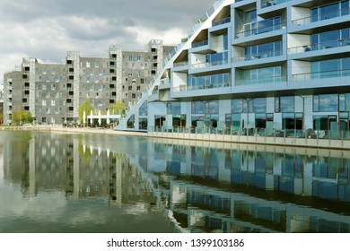 COPENHAGEN, DENMARK - MAY 14, 2019: House, 8 Tallet, Big House - Residential Housing, Built In The Shape Of A Figure 8.  Promenade, Cycle Track. Copenhagen, Denmark.