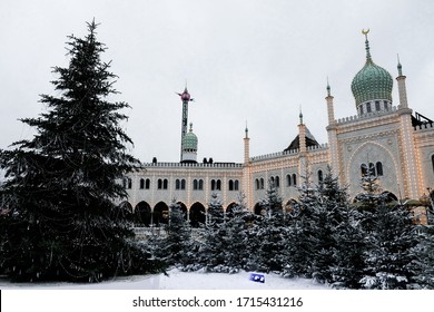 Copenhagen / Denmark - November 2019: Beautiful Boutique Nimb Hotel In Tivoli Gardens Decorated For Christmas. White Moorish Palace Highlighted In Winter Time. Snowy Fairy Tale Vibe For Tourists.