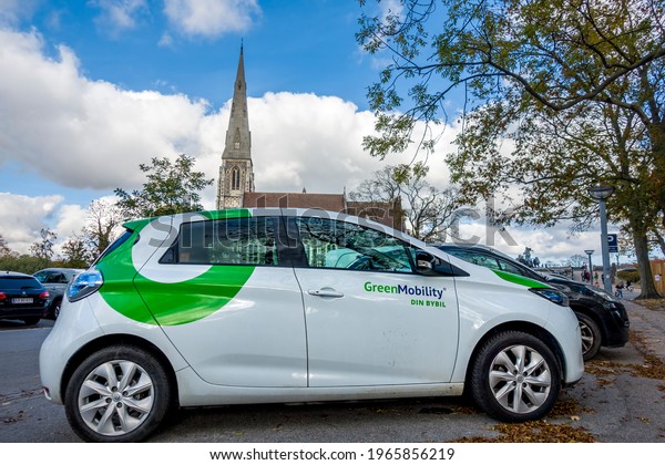 Copenhagen,\
Denmark - Oct 19, 2018: Green Mobility electric car parked at a car\
parking area along Churchillparken\
Street.