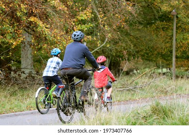 COPENHAGEN, DENMARK, OCTOBER 2, 2019: Father On A Bike Ride With His Sons. Neighborhood Of Copenhagen.