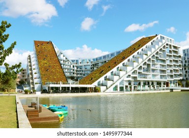 COPENHAGEN, DENMARK - SEPTEMBER 2, 2019: 8 House, 8 Tallet, Big House - Residential Housing, Built In The Shape Of A Figure 8. Promenade, Cycle Track, Green Roof. 