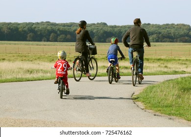 COPENHAGEN, DENMARK - SEPTEMBER 30, 2017: Family On A Bike Ride Around Copenhagen. Bayern Munchen. Football.