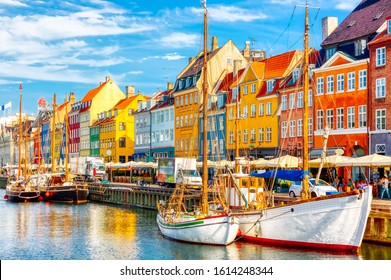 Copenhagen iconic view. Famous old Nyhavn port in the center of Copenhagen, Denmark during summer sunny day