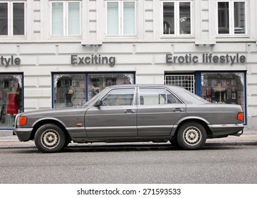 COPENHAGEN - MAY 16, 2012: Side View Of Old Car Against Sex Shop At The Famous Vesterbro District In Copenhagen, Denmark, May 16, 2012