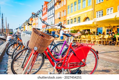 Copenhagen old town, Nyhavn harbour, selective focus on a front bicycle. Nyhavn is most popular touristic attraction place in copenhagen, Denmark