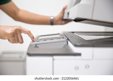 Copier Printer, Close Up Hand Office Man Press Copy Button On Panel To Using The Copier Or Photocopier Machine For Scanning Document Printing A Sheet Paper And Xerox Photocopy.