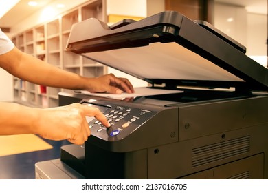 Copier printer, Close up hand office man press copy button on panel to using the copier or photocopier machine for scanning document printing a sheet paper and xerox photocopy.