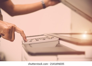 Copier Printer, Close Up Hand Office Man Press Copy Button On Panel To Using The Copier Or Photocopier Machine For Scanning Document Printing A Sheet Paper And Xerox Photocopy.