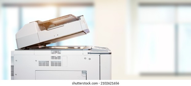 Copier printer, Close up the photocopier or photocopy machine office equipment workplace for scanner or scanning document and printing or copy paper and xerox. - Shutterstock ID 2102621656