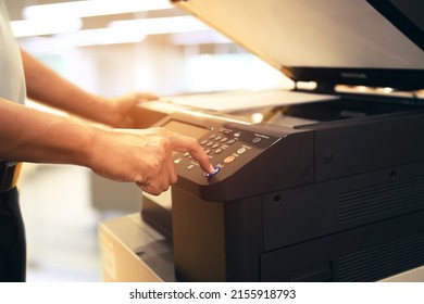 Copiers Printer, Close Up Hand Office Man Press Copy Button On Panel To Using The Copier Or Photocopier Machine For Scanning Document Printing A Sheet Paper And Xerox Photocopy.