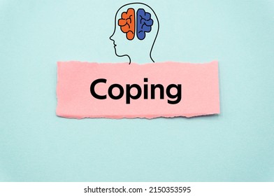 Coping.The word is written on a slip of colored paper. Psychological terms, psychologic words, Spiritual terminology. psychiatric research. Mental Health Buzzwords. - Shutterstock ID 2150353595