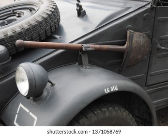 Copparo, Italy - April 14, 2019. Historical Reenactment Of The Second World War. Vintage Jeep, Detail. Spade, Headlight, Spare Tire.