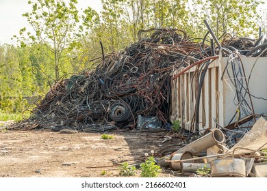 Copper cables for reworking. Processing industry, a pile of old scrap metal, ready for recycling. Scrap metal recycling. Scrap copper cable for reworking. Processing industry, a pile of old scrap - Shutterstock ID 2166602401