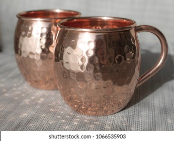 Copper Cups For Mule Cocktails Unfilled With Sun Reflecting And Soft Colours