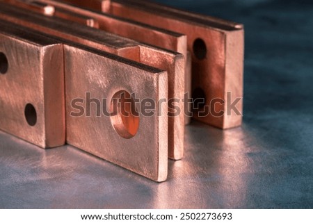 Copper flat bars, clean and polished, close-up view
