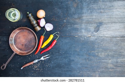 Copper Frying Pan On A Black Wooden Table, Cooking Background , Top View.