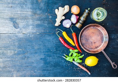 Copper Frying Pan On A Black Wooden Table, Cooking Background , Top View.