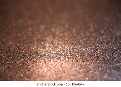 Copper Glitter Abstract Bokeh Background.