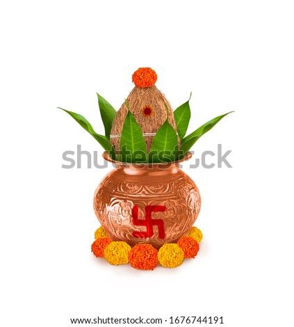Copper and gold kalash with coconut and mango leaf with marigold flower decoration at the bottom for hindu puja 
for all hindu pooja occasions 