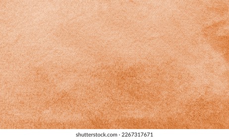 Copper gold velvet background or golden orange amber velour flannel texture made of cotton or wool with soft fluffy velvety satin fabric cloth metallic color material   
