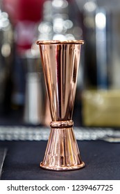 Copper Jigger For Cocktails Is On The Bar.